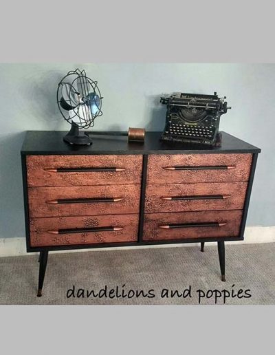 Chest of Drawers - Lamp black and copper over embossed drawers